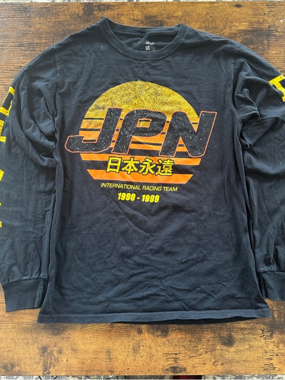 Fashion Nova Black Long-Sleeve Graphic Tee with Yellow and Orange Print